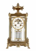 French brass four glass two train mantel clock, the 3.5" white chapter ring enclosing a skeletonised