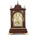 Good mahogany triple fusee boardroom clock, the 7.5" rounded arched brass dial with silvered chapter