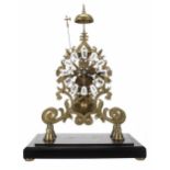 Brass single fusee skeleton clock with passing strike on a bell, the 6" pierced chapter ring with