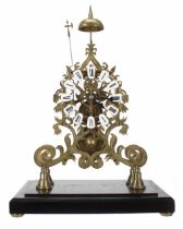 Brass single fusee skeleton clock with passing strike on a bell, the 6" pierced chapter ring with