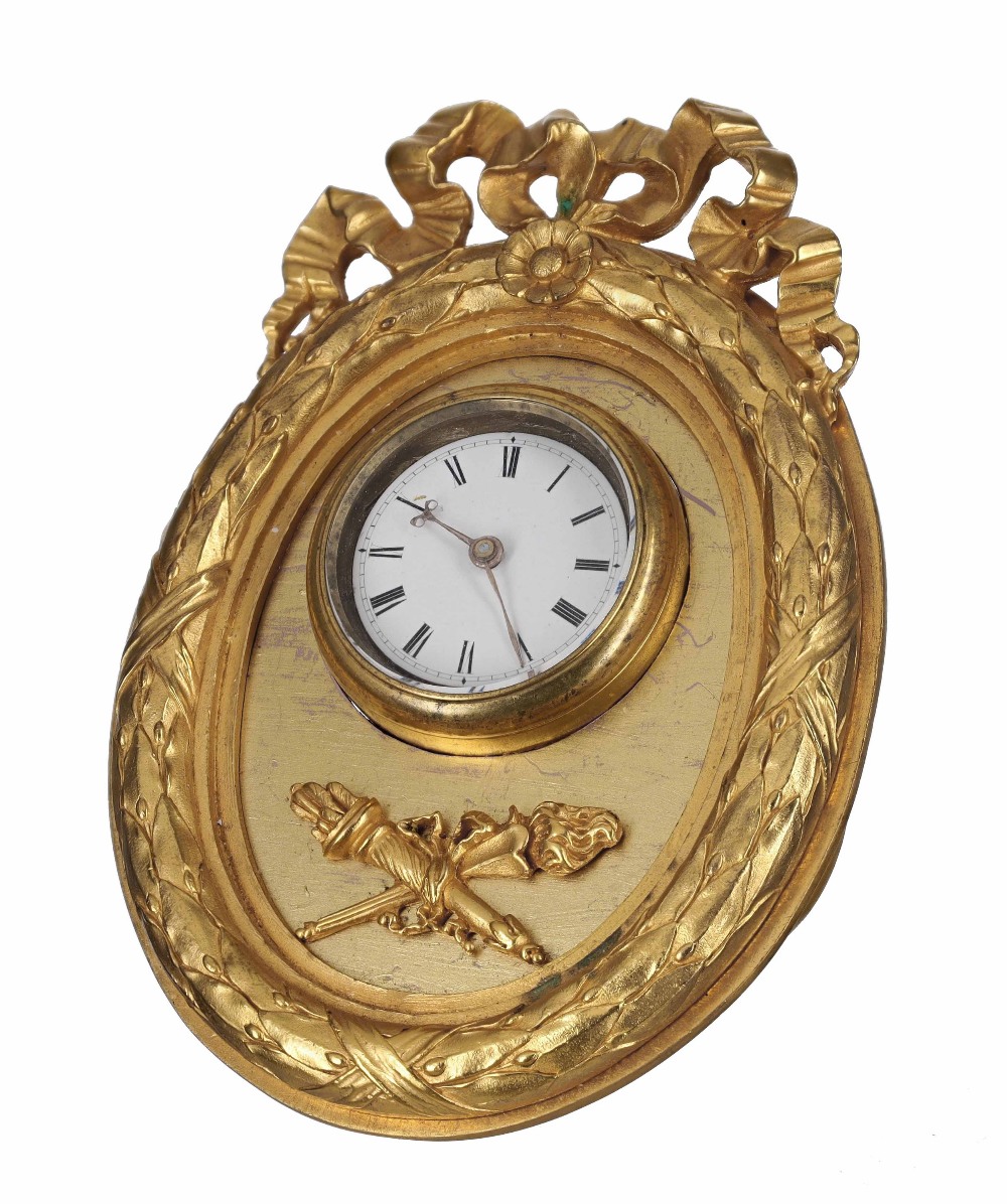 Ormolu oval easel timepiece, the watch movement signed Vulliamy, London, within an oval frame