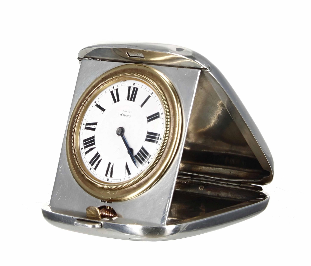 Rolex Wilsdorf Silver cased Harrods eight days travelling clock, within a folding striped case