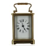 Small carriage clock timepiece within a corniche brass case, 4.75" high (key)