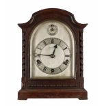 English oak three train mantel clock, the 5.5" silvered arched dial signed Botly & Lewis, Reading,
