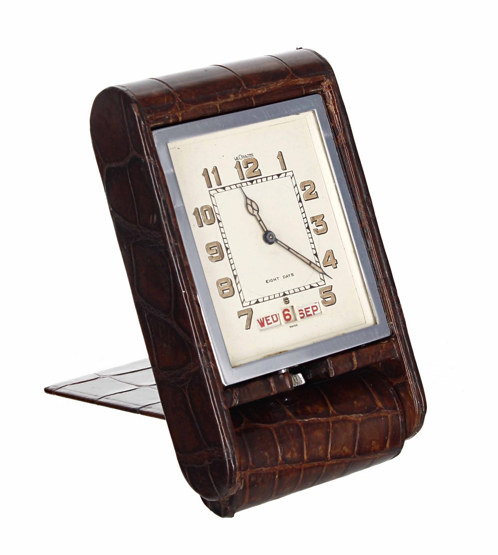 LeCoultre 8 Days travel clock with calendar, within a chrome casing and brown leather folding travel