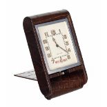 LeCoultre 8 Days travel clock with calendar, within a chrome casing and brown leather folding travel