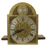 Three train longcase clock movement quarter chiming on eight rods, the 11" brass arched dial