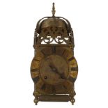 Brass two train lantern clock case with later movement, the 6.5" brass dial enclosing a foliate