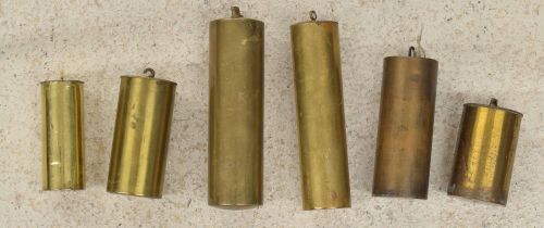 Six various size brass cased weights (6)