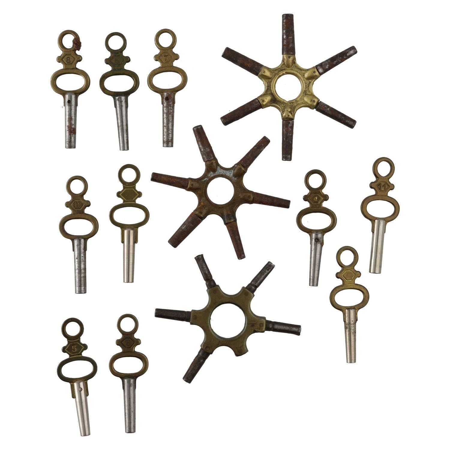 Two spider pocket watch keys; together with a part spider pocket watch key and ten pocket watch keys