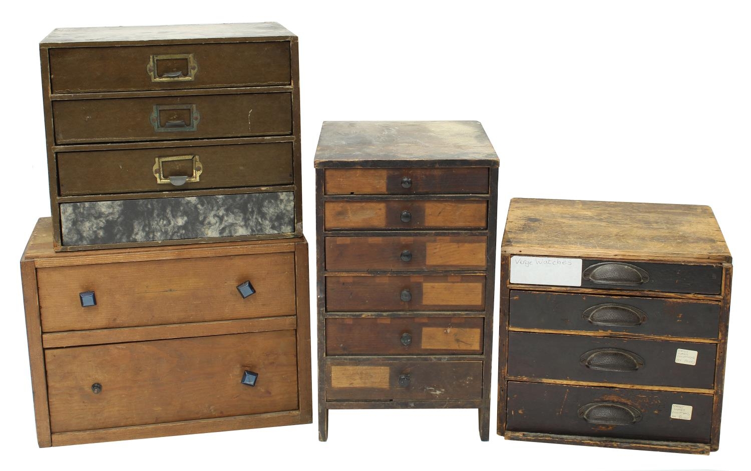 Four small storage chests containing a quantity of assorted watch glasses