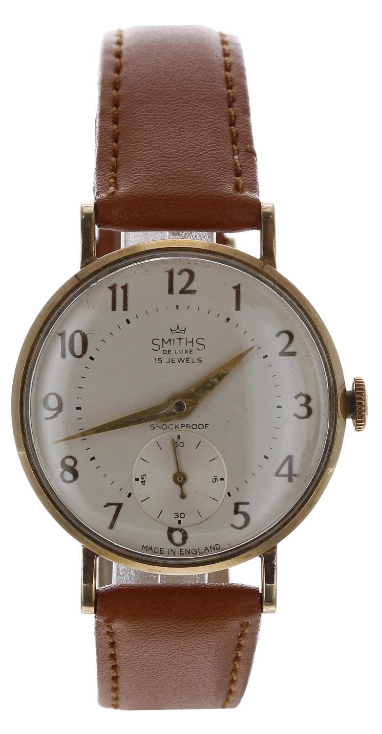 Smiths De Luxe 9ct gentleman's wristwatch, London 1962, circular silvered dial with applied gilt