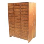 Twelve drawer wooden chest containing a quantity of assorted watch glasses of various sizes, 27.25''