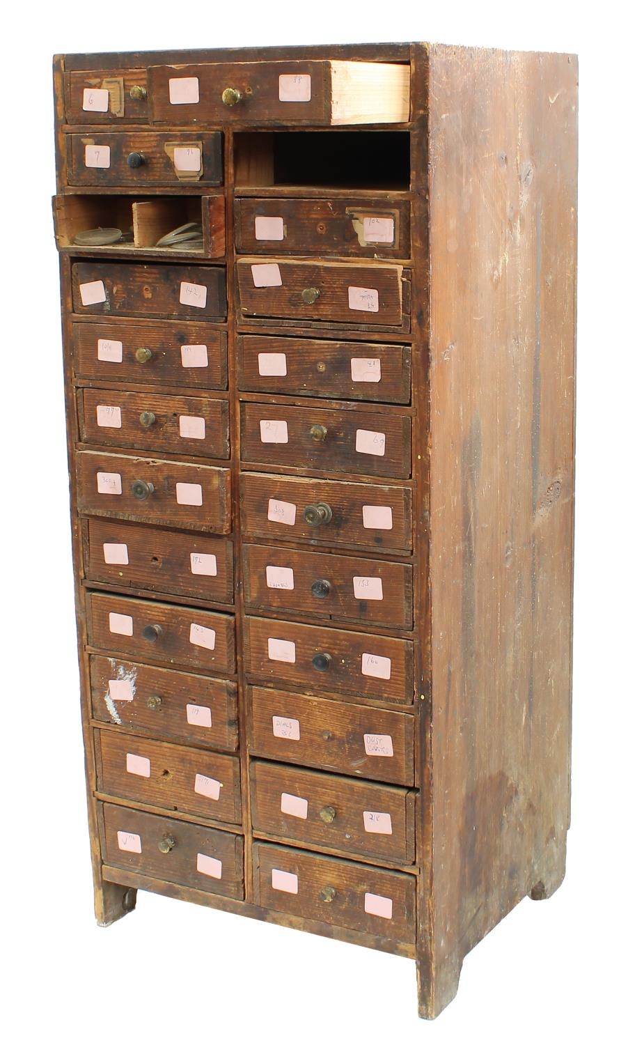 Twelve drawer wooden chest containing a quantity of assorted watch glasses of various sizes, 27.