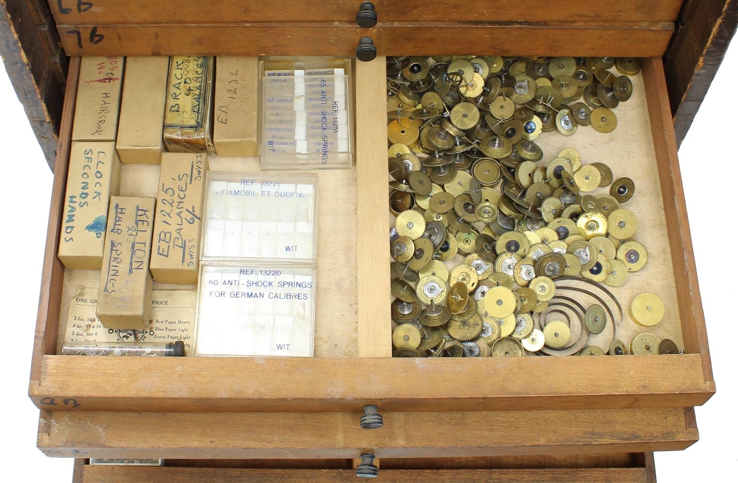 Twelve drawer wooden chest containing a quantity of watch parts including balances, stems, wheels, - Image 4 of 10