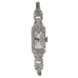 Attractive 1920s platinum and diamond lady's cocktail watch, case no. 3890, rectangular silvered