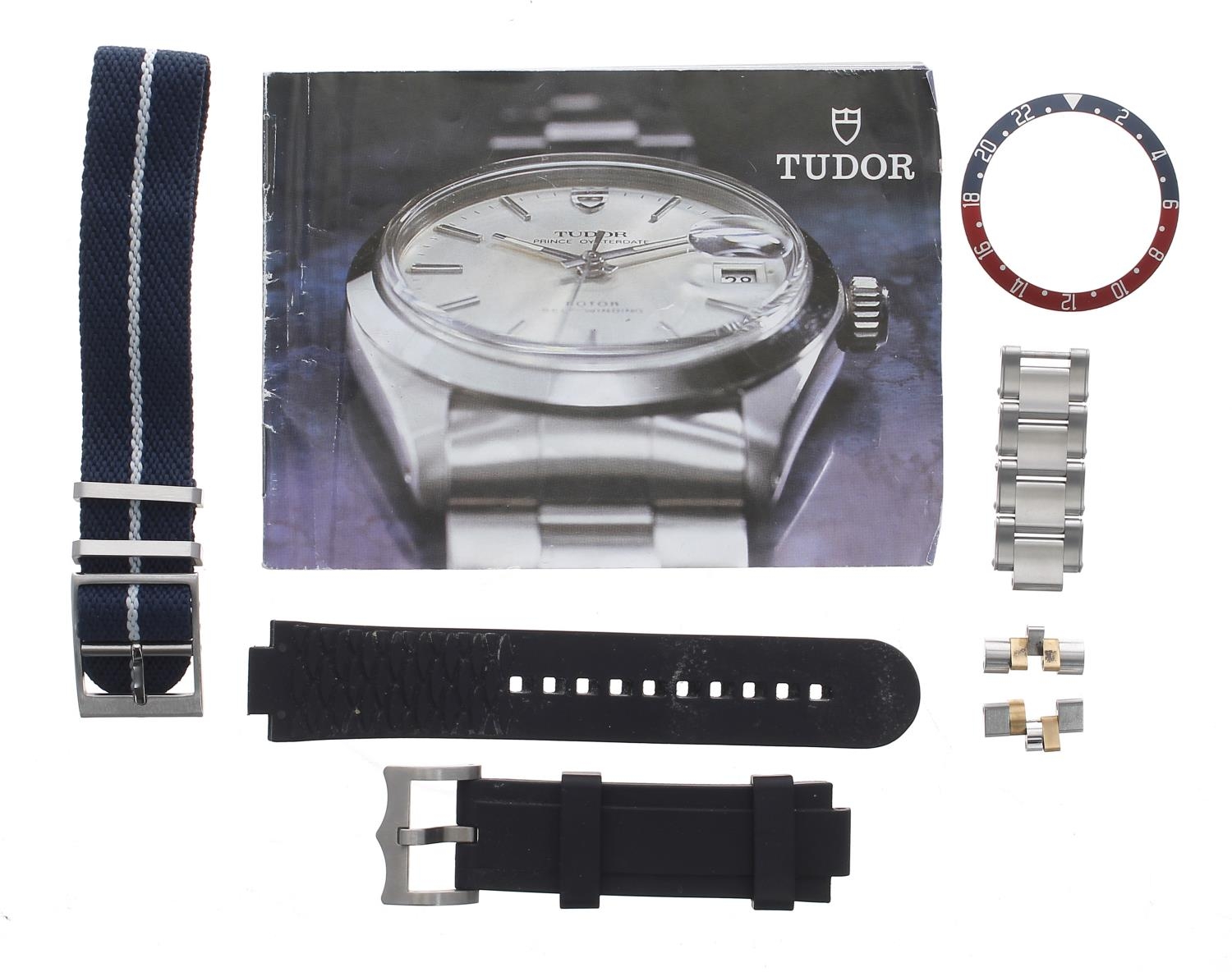 Tudor bezel insert; together with a Tudor black rubber wristwatch strap; two sets of spare