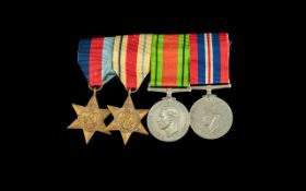 WW2 Group of Four Medals War and Defence Medal 1939-1945 Star and Africa Star on a bar.