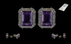 Certificated pair of 18ct white gold large stud earrings set with step-cut eye clean Amethysts