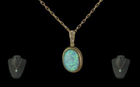 Ladies Attractive 9ct Gold Opal Set Pendant with Diamond Set Holder, with Attached 9ct Gold Chain.