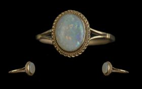 Ladies Attractive 9ct Gold Single Stone Opal Set Ring. Full Hallmark to Shank. The Oval Shaped