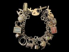Chunky 9ct Gold Charm Bracelet Loaded with Charms. Nice and Impressive and Smooth to the Touch.