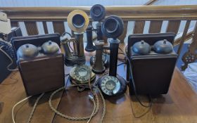 Traditional Candlestick Telephones. Two black, and one brass. The candlestick telephone (or pole