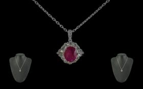18ct White Gold Oval Ruby and Diamond Cluster Pendant on an 18ct white gold chain, boxed. Ruby 2.