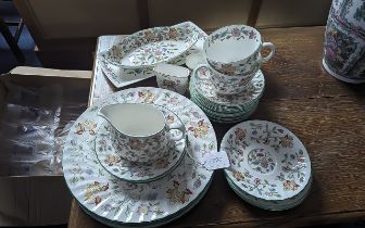 Minton 'Haddon Hall' part set, comprising milk jug, sugar bowl, two tea cups, 13 saucers, oval bon