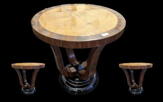 French Art Deco Style Table, of circular form, with four veneered supports on a black lacquered