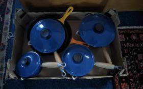 Le Crueset Pan Set. Set of ( 4 ) Pans and Lids and Two Large Pans In Orange Colour.