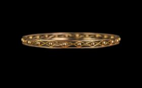 Edwardian Period 1902-1910 Pleasing 9ct Gold Openworked Bangle, marked 9ct. Criss/cross bauble