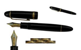 A Mont Blanc Meisterstuck 149 Fountain PEn, in black with gold clip and bands. 14ct gold nib.