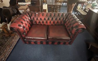 Chesterfield Two Seater Sofa in Oxblood Leather, length approx 60'', depth 32'', height 24'',
