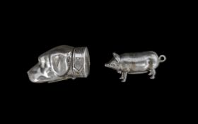 Two Silver Vesta Cases, modelled in the form of a pig and a dog's head.