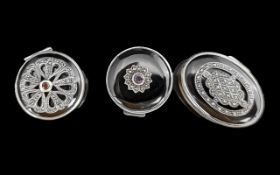 Three Silver Pill Boxes with Onyx and Marcasite lids.