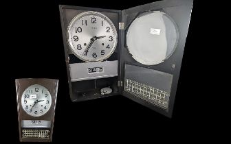 Seiko Japanese Date Clock. A Seiko wall clock, with 19cm silvered dial and calendar day-date display