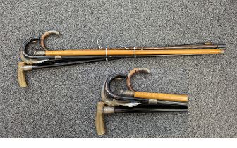 Five Silver Topped Walking Canes, horn handles, silver ferrules, longest 35''.