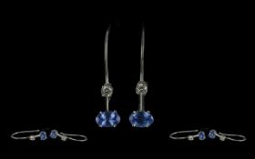 Pair of 14ct White Gold Drop Earrings, set with Tanzanite and diamond. Drop style with small round