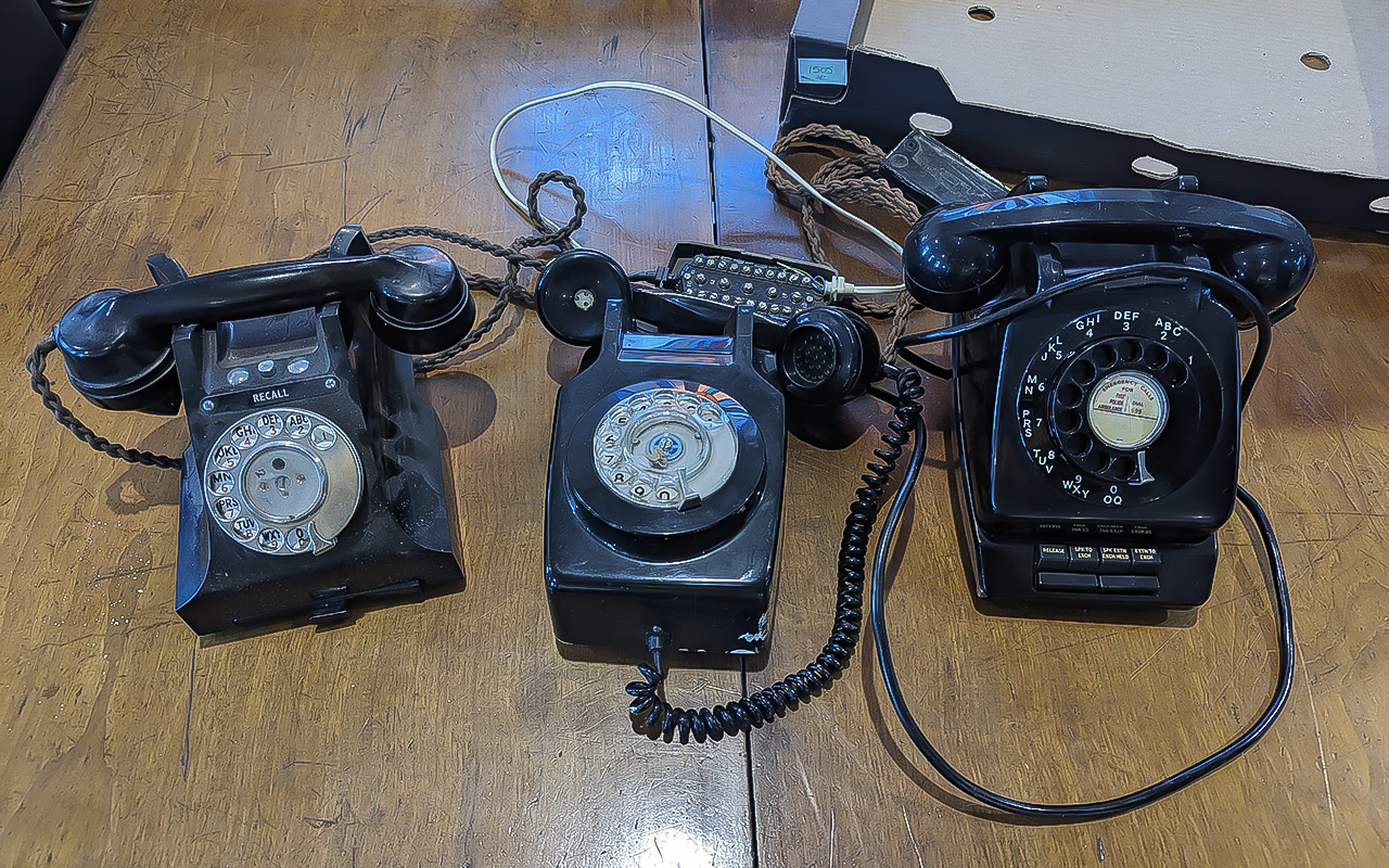 Vintage Plantset Desktop Telephone Exchange, black, together with a black vintage telephone with