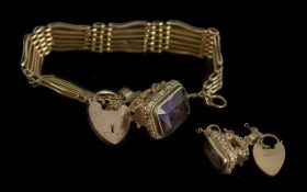 A Fine Quality Ladies 9ct Gold 6 Bar Fancy Bracelet with 9ct gold heart shaped Padlock with