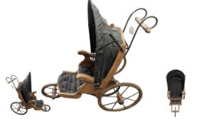 A Reproduction Dolls Pram in the style of Joel Ellis credited as the first wooden doll maker in