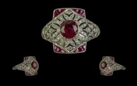 Victorian-style platinum ruby and diamond dress ring, with a pierced ornate setting. Round-cut and