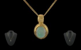 Ladies Attractive 18ct Gold Opal Set Pendant Attached to a 18ct Gold Chain. Marked 750 - 18ct. The
