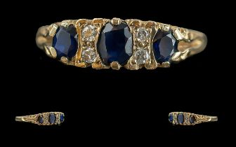 Ladies Pleasing 9ct Gold Sapphire & Diamond Set Ring. Ornate raised setting, full hallmark to shank.