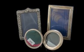 Four Silver Photograph Frames, circular oak backed with struts, one ebony backed with struts and two