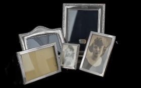 Collection of Silver Photograph Frames, comprising a small silver wood backed frame measuring 4''