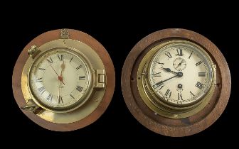 Two Vintage Ship's Clocks, one by Smiths and one Nauticalia, both mounted on wooden bases.