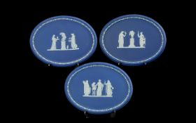 Wedgwood Fine Trio of Early Blue Jasper Ware Wall Plaques, each of oval form, depicting raised,