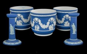 Wedgwood Collection of Blue Jasper Ware comprising a pair of candlesticks and a fine trio of three